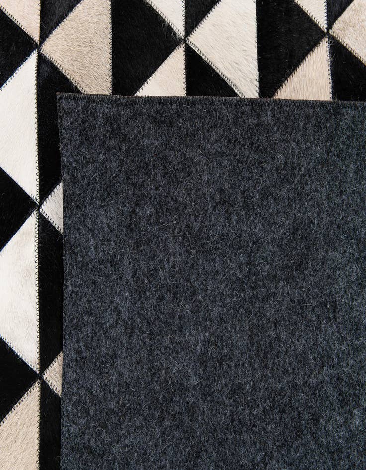 Detail image of  5' 1 x 8' 1 Cowhide Stocks Rug