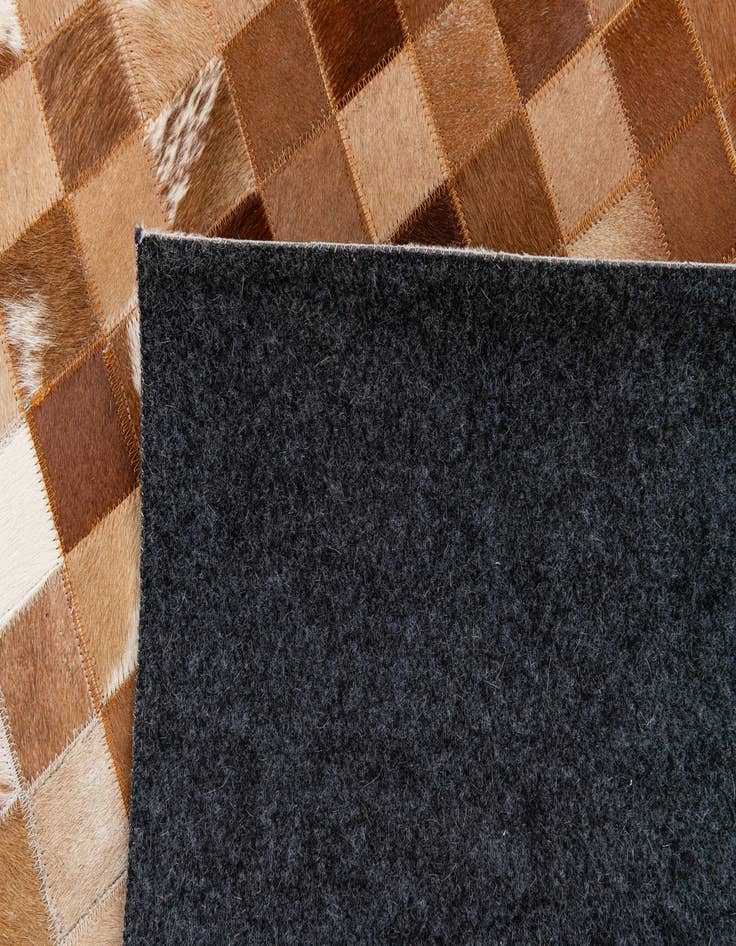 Detail image of  4' 11 x 7' 9 Cowhide Stocks Rug