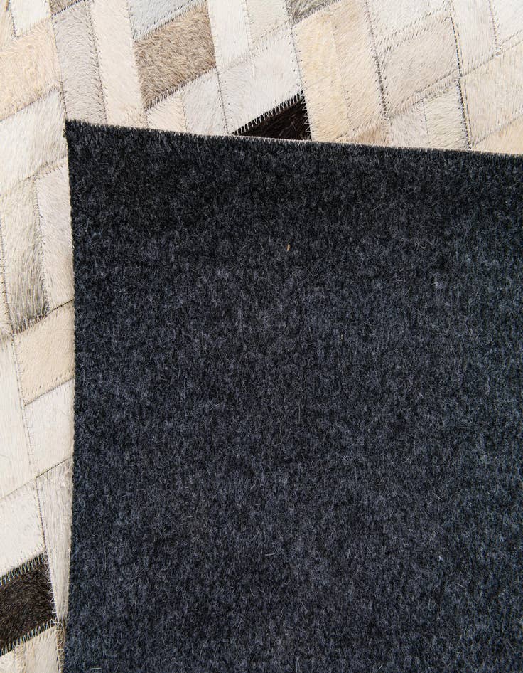 Detail image of  5' 3 x 7' 5 Cowhide Stocks Rug