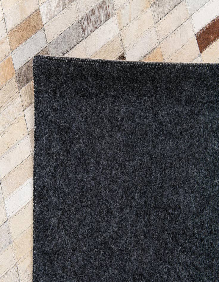 Detail image of  5' 1 x 7' 10 Cowhide Stocks Rug