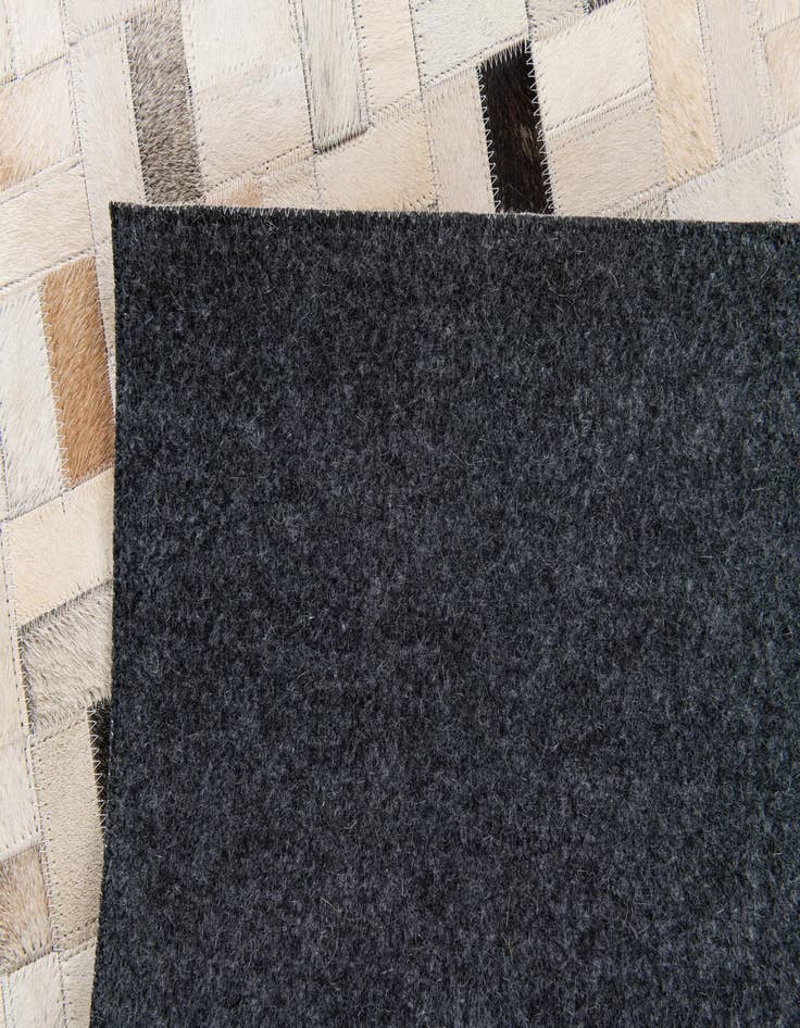 Detail image of  5' 3 x 7' 6 Cowhide Stocks Rug