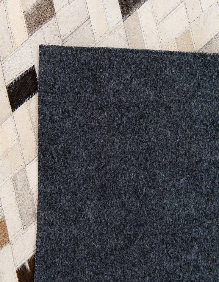 Detail image of  5' 3 x 7' 5 Cowhide Stocks Rug