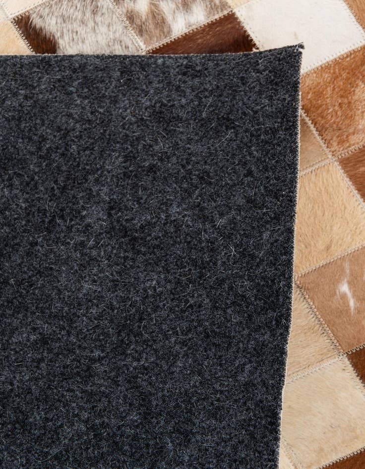 Detail image of  5' 1 x 7' 11 Cowhide Stocks Rug