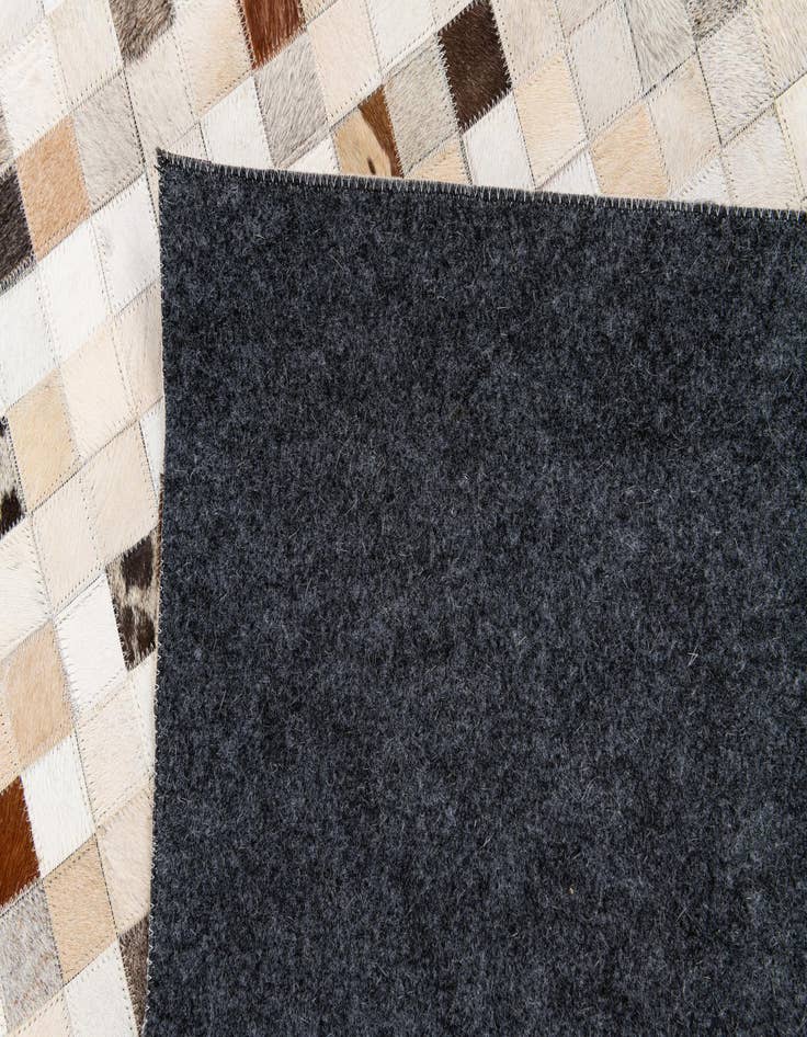 Detail image of  5' x 7' 11 Cowhide Stocks Rug