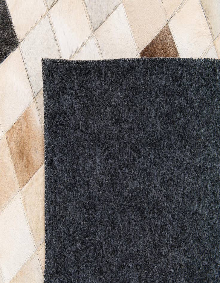 Detail image of  5' 1 x 7' 11 Cowhide Stocks Rug