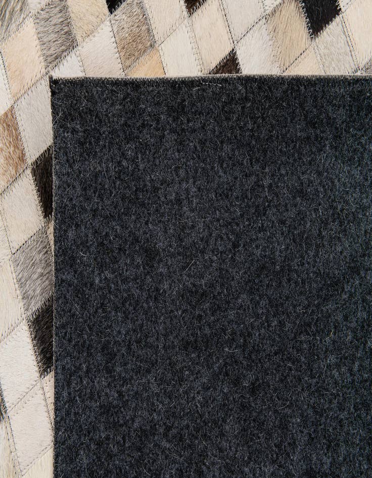 Detail image of  5' x 7' 11 Cowhide Stocks Rug