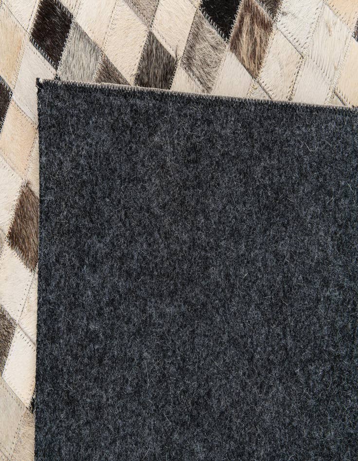 Detail image of  5' 1 x 7' 11 Cowhide Stocks Rug