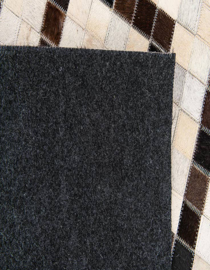 Detail image of  5' 1 x 8' Cowhide Stocks Rug