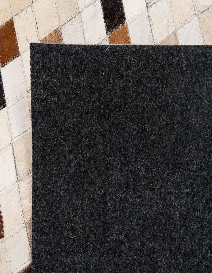 Detail image of  5' x 7' 11 Cowhide Stocks Rug