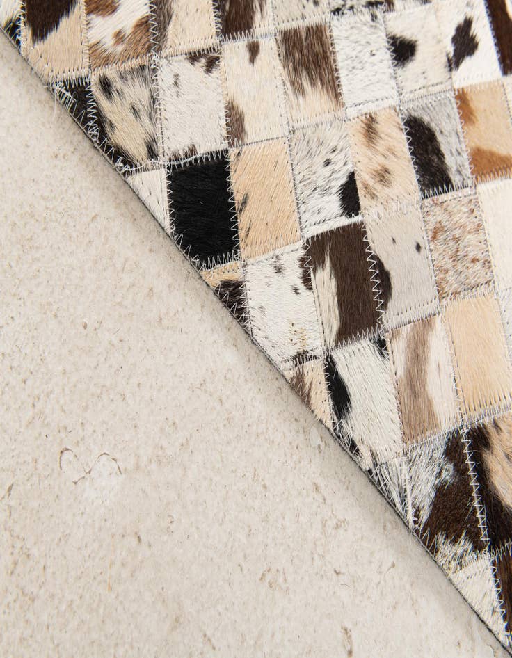 Detail image of  5' x 7' 11 Cowhide Stocks Rug