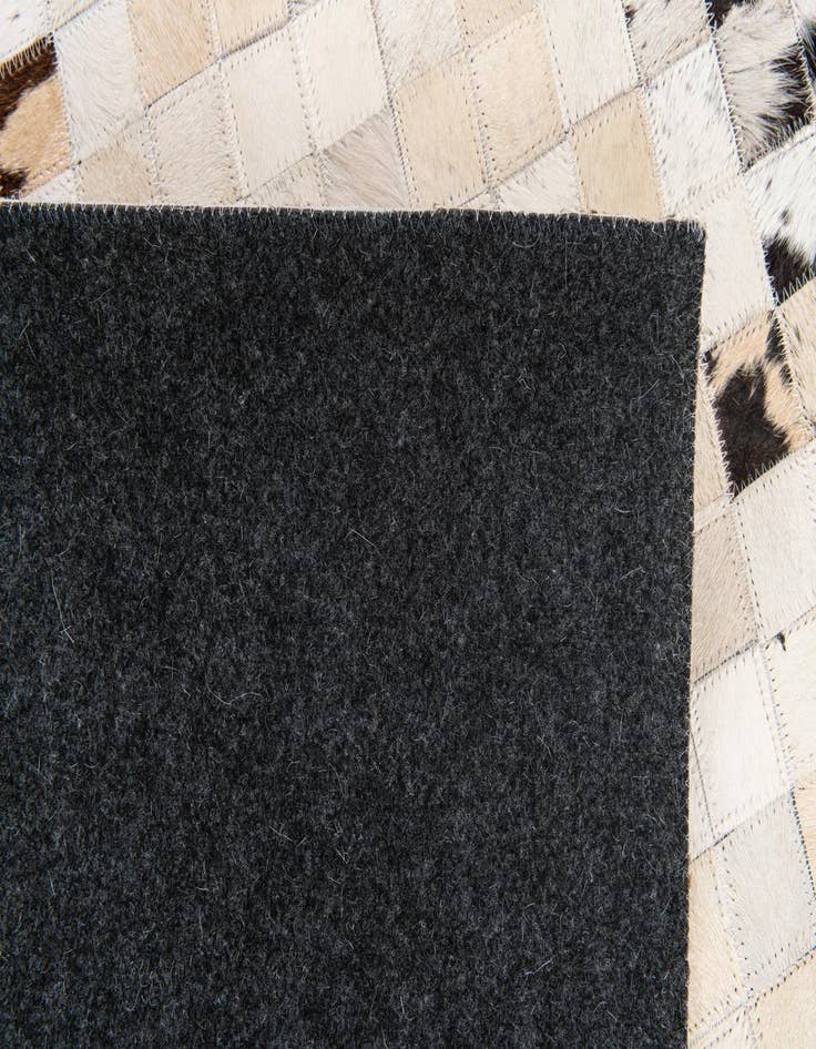 Detail image of  5' x 7' 11 Cowhide Stocks Rug