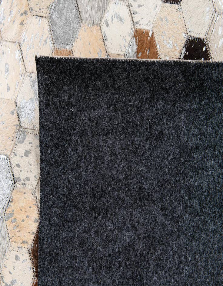Detail image of  5' 2 x 7' 5 Cowhide Stocks Rug