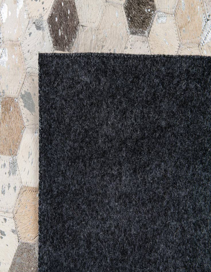 Detail image of  5' 1 x 8' 1 Cowhide Stocks Rug