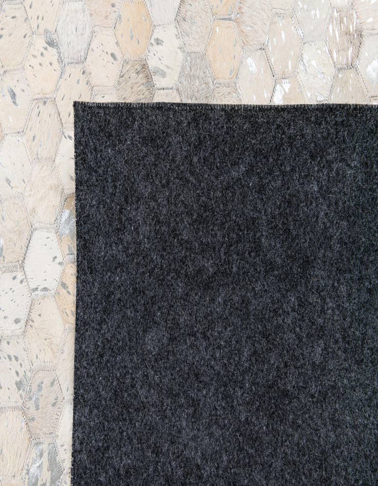 Detail image of  5' 1 x 8' 1 Cowhide Stocks Rug