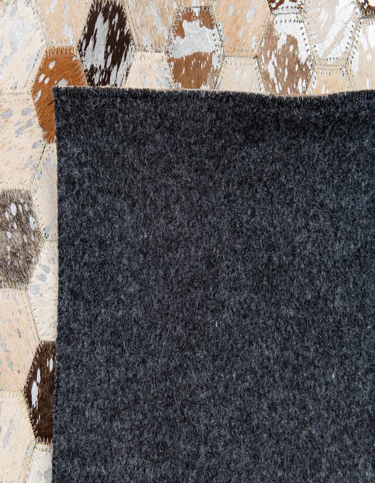 Detail image of  5' 3 x 7' 6 Cowhide Stocks Rug