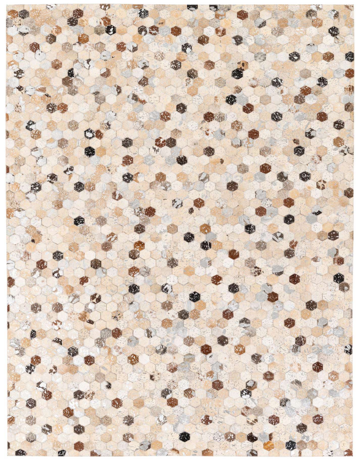 A 5x8 rectangular Cowhide Stocks rug from Rugs.com, featuring a modern hexagonal patchwork in multi-colored natural cowhide and leather.