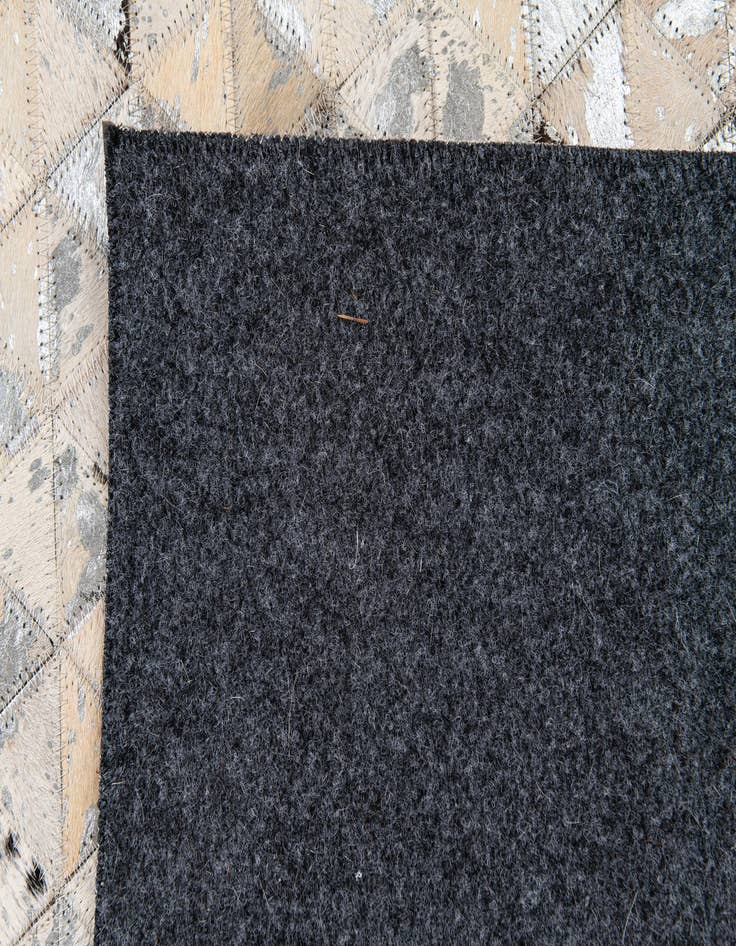 Detail image of  5' 3 x 7' 5 Cowhide Stocks Rug