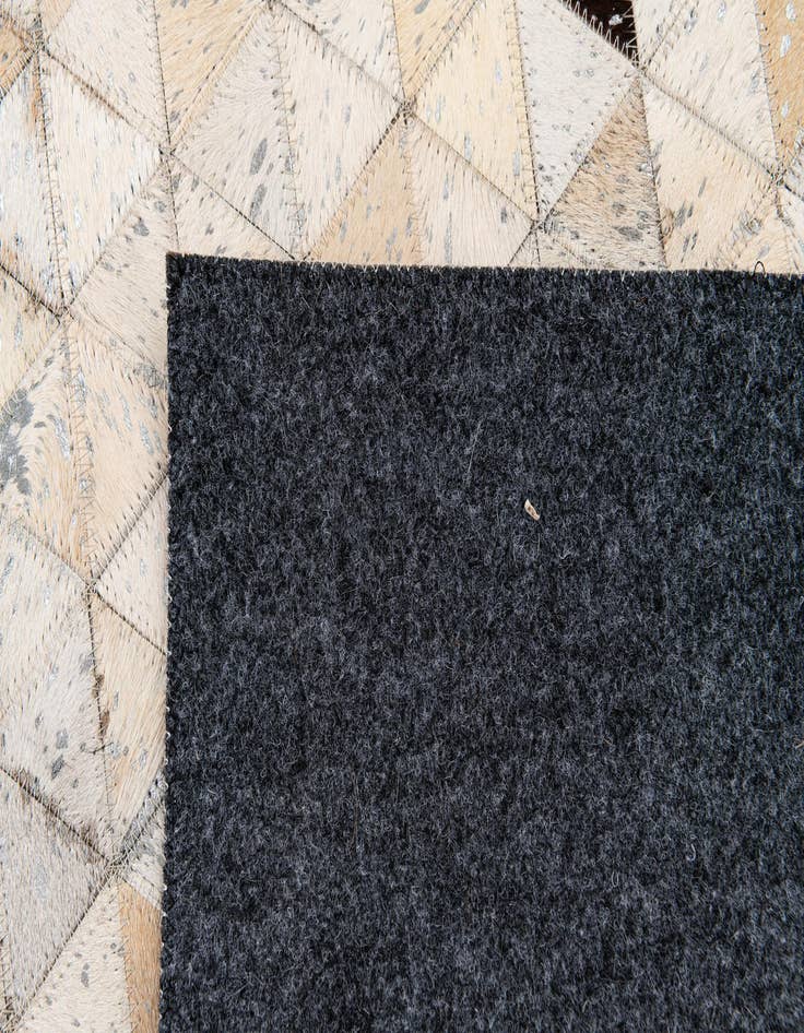 Detail image of  5' 3 x 7' 7 Cowhide Stocks Rug