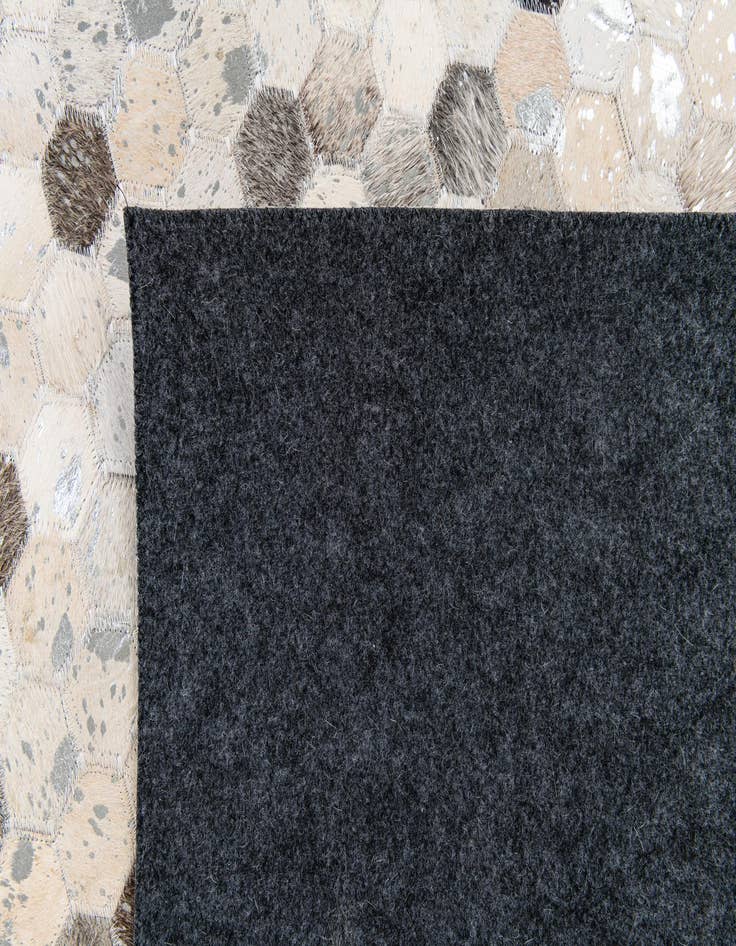 Detail image of  5' 1 x 8' Cowhide Stocks Rug