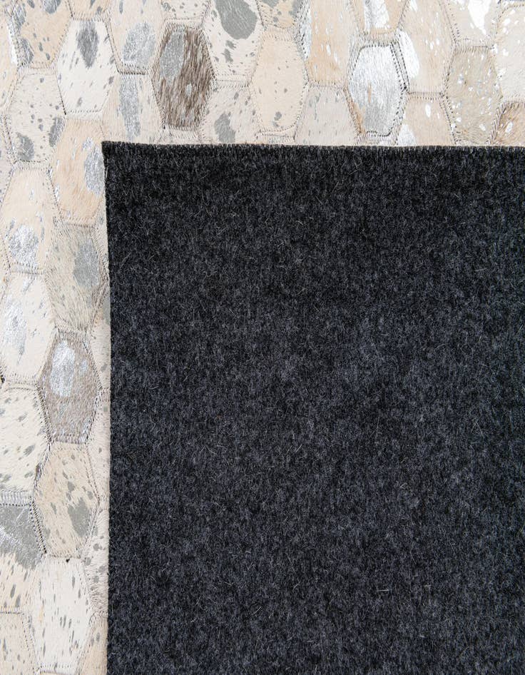 Detail image of  5' 1 x 8' Cowhide Stocks Rug