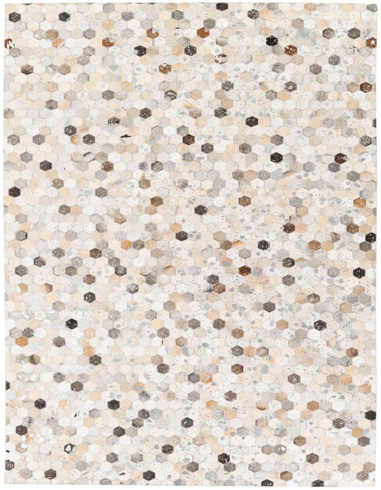 A rectangular 5x8 modern multi-colored cowhide rug with a mosaic of hexagonal patches in varying natural tones.