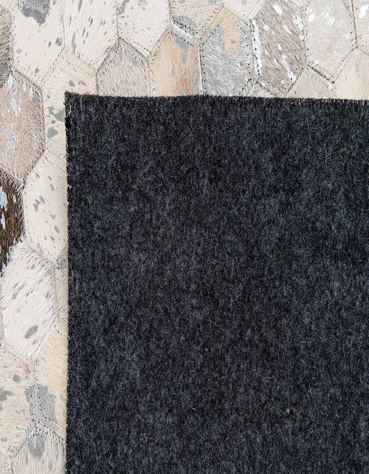 Detail image of  5' 1 x 8' 2 Cowhide Stocks Rug