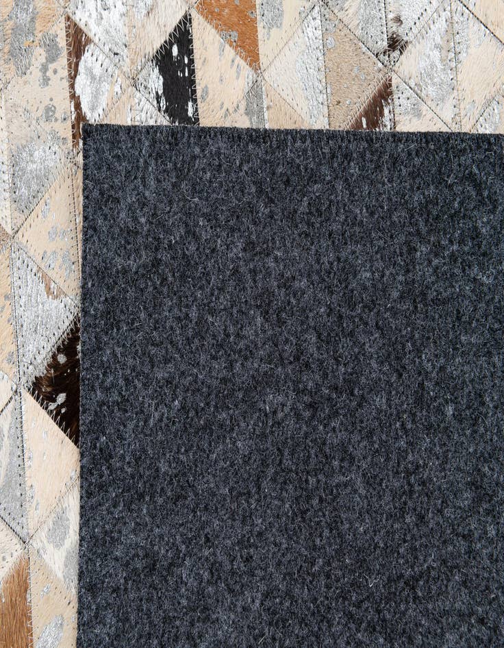 Detail image of  5' 3 x 7' 7 Cowhide Stocks Rug