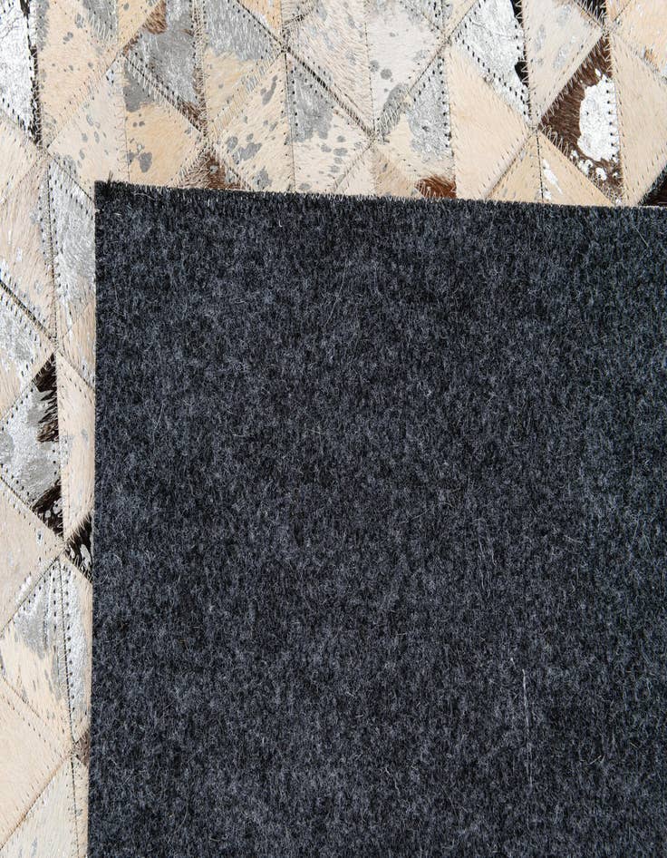 Detail image of  5' 3 x 7' 5 Cowhide Stocks Rug