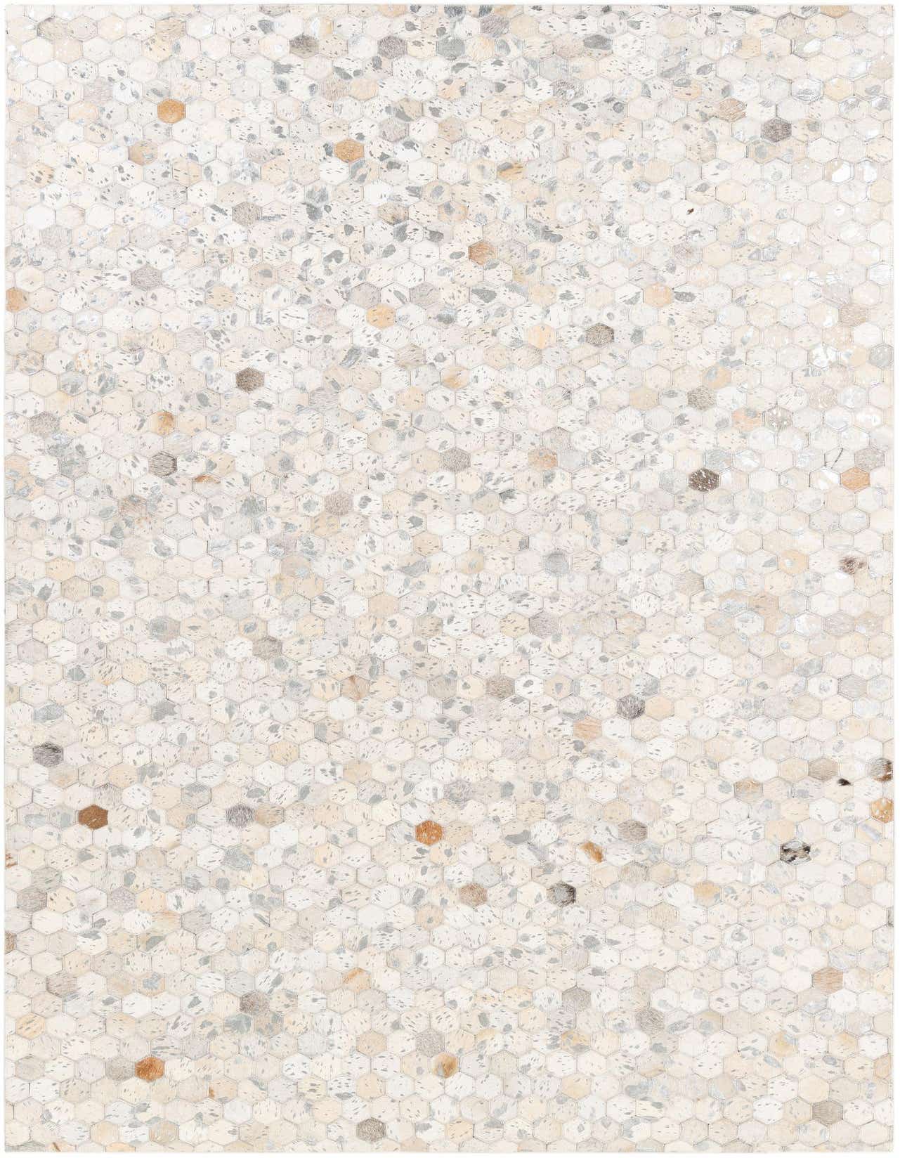 A 5x8 rectangular patchwork cowhide rug with a geometric pattern in multi-colored natural tones, ideal for a living room.