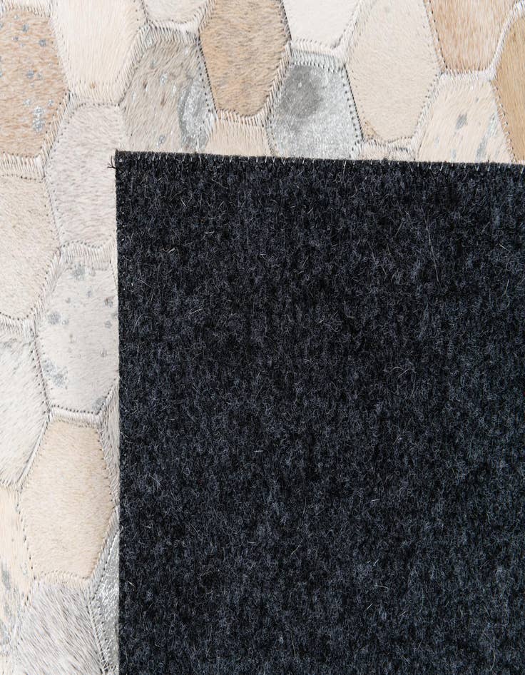 Detail image of  5' x 7' 11 Cowhide Stocks Rug