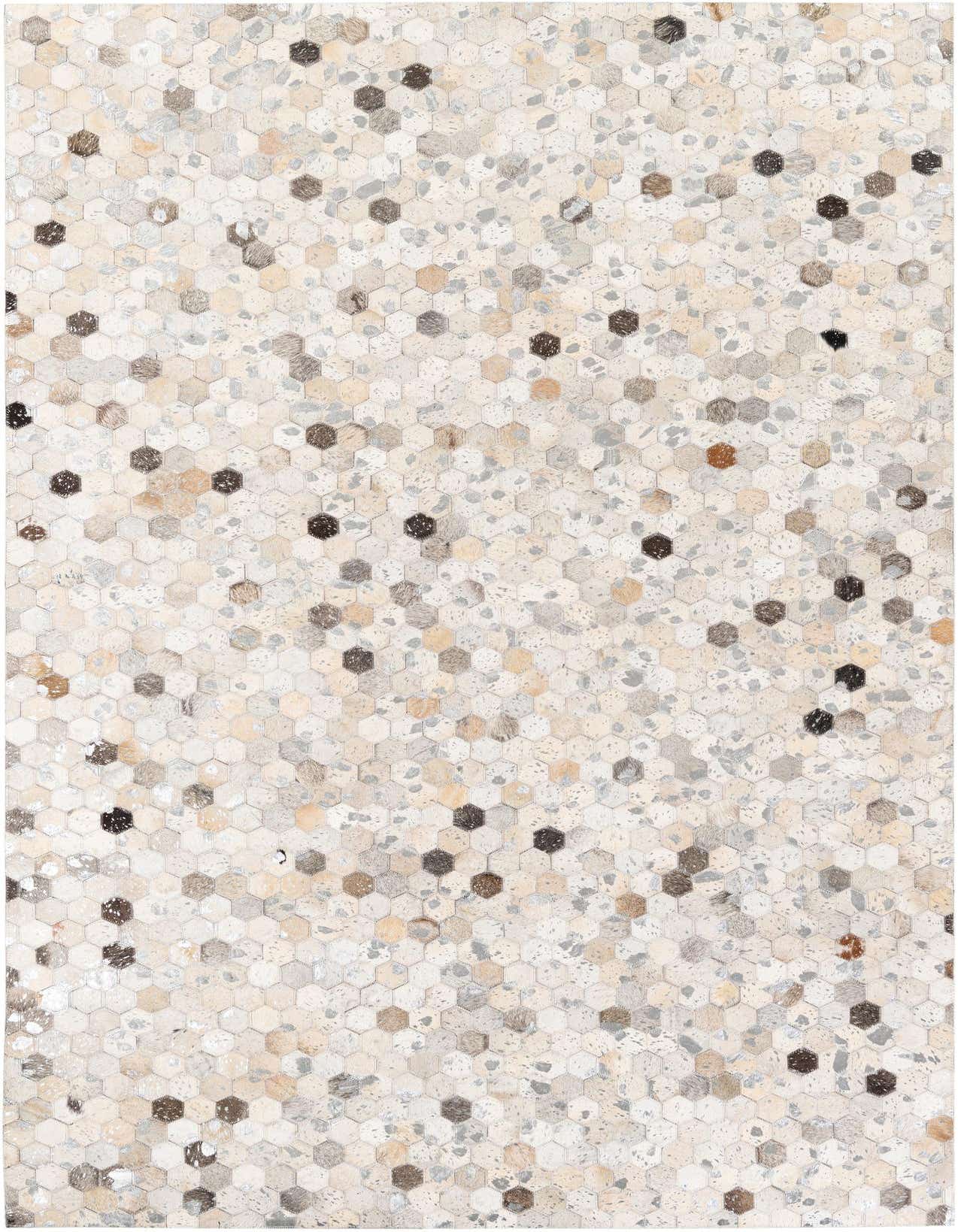 A rectangular 5x8 modern multi-colored cowhide rug with a hexagonal patchwork pattern, ideal for a living room.