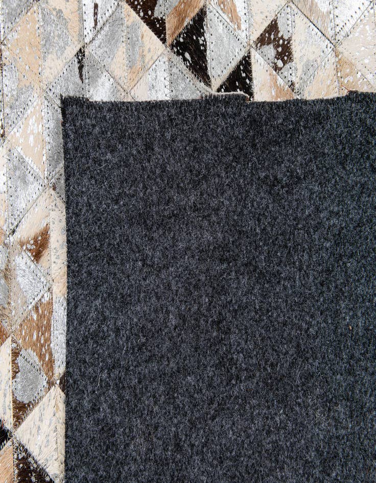 Detail image of  5' 3 x 7' 6 Cowhide Stocks Rug