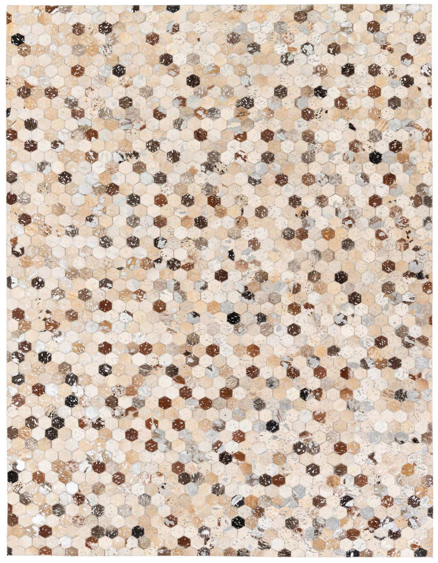 A rectangular 5x8 modern rug featuring a mosaic of multi-colored hexagonal cowhide and leather patches.