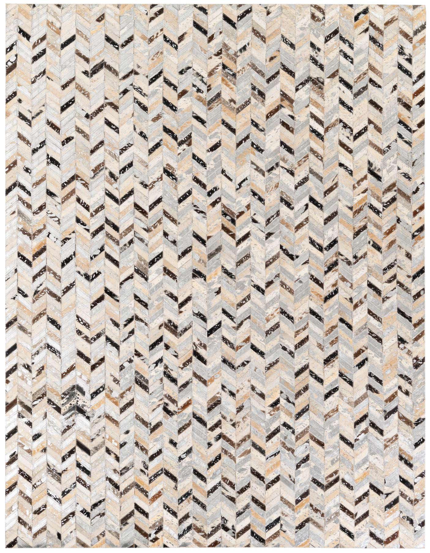 A rectangular 5x8 multi-colored cowhide rug with a modern chevron pattern, featuring natural shades of brown, black, cream, and gray.