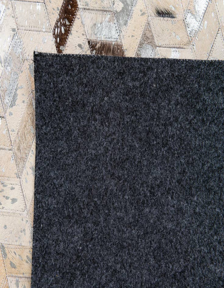 Detail image of  5' 4 x 7' 7 Cowhide Stocks Rug