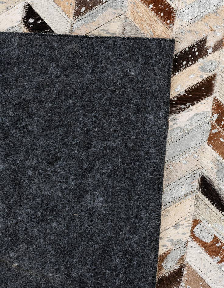 Detail image of  5' 3 x 7' 3 Cowhide Stocks Rug