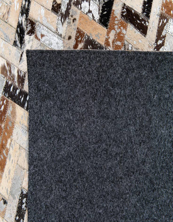 Detail image of  5' 3 x 7' 6 Cowhide Stocks Rug