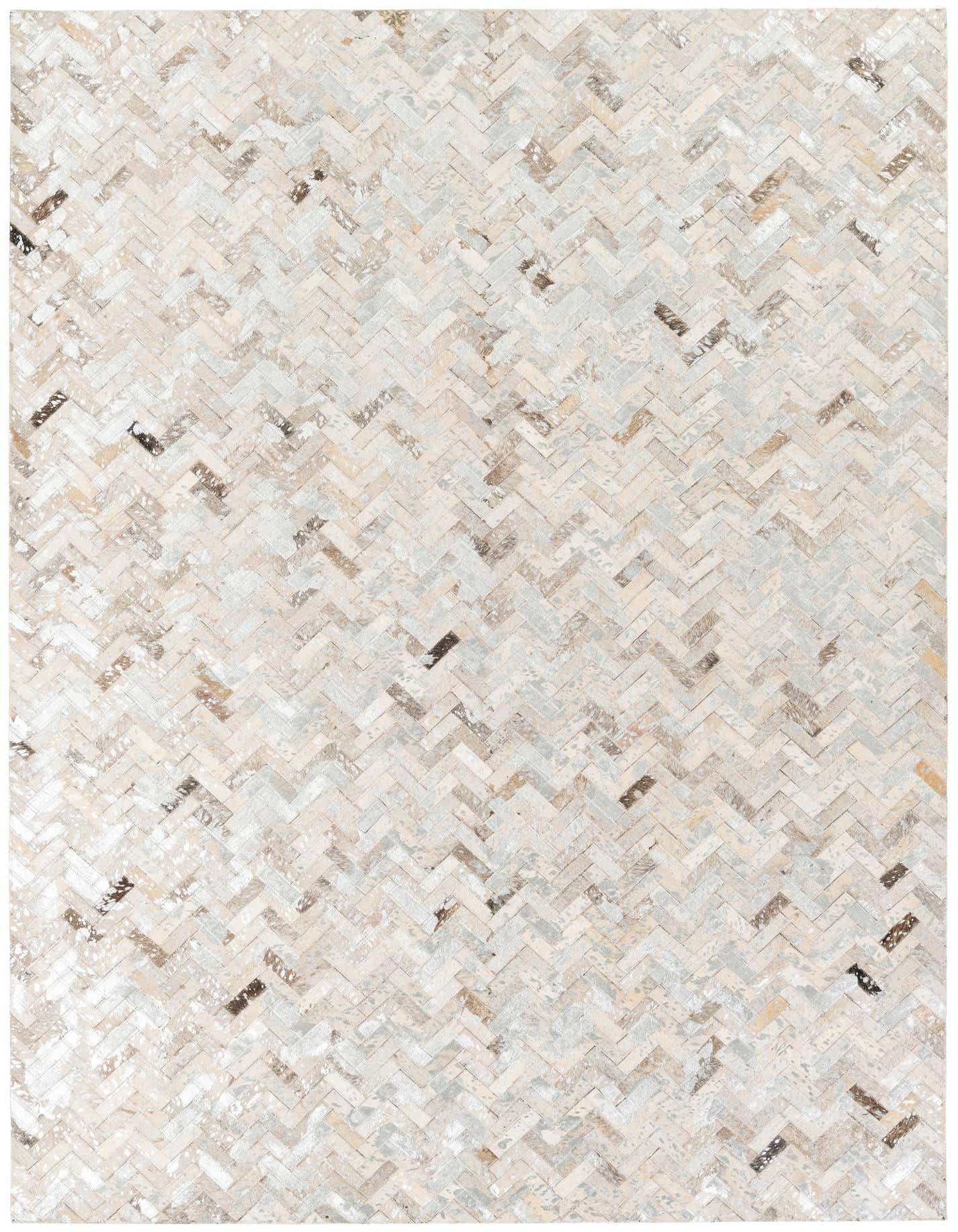 A rectangular 5x8 modern area rug featuring a multi-colored herringbone pattern made from cowhide and leather.