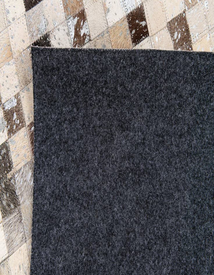 Detail image of  5' 3 x 7' 6 Cowhide Stocks Rug