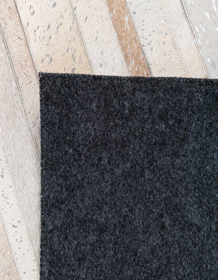 Detail image of  5' 1 x 8' 1 Cowhide Stocks Rug