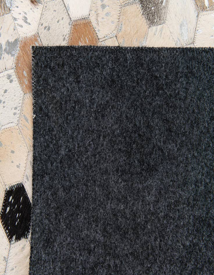 Detail image of  5' 1 x 8' 1 Cowhide Stocks Rug