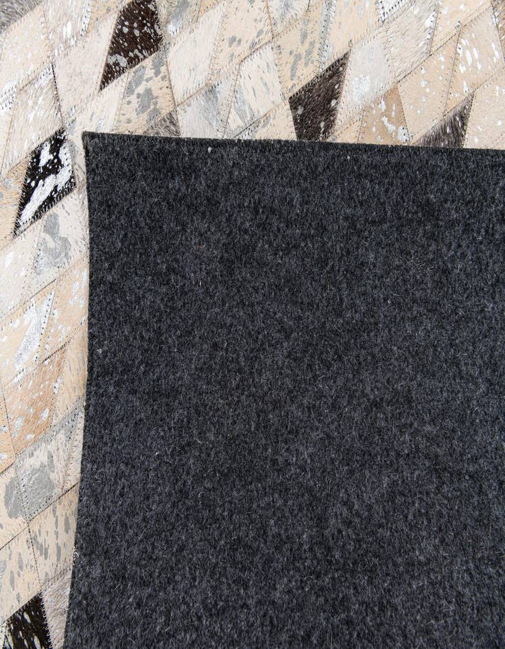 Detail image of  5' 3 x 7' 5 Cowhide Stocks Rug