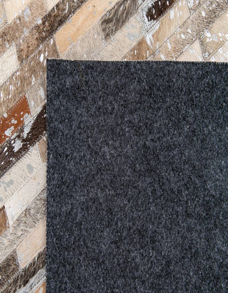 Detail image of  5' 4 x 7' 7 Cowhide Stocks Rug