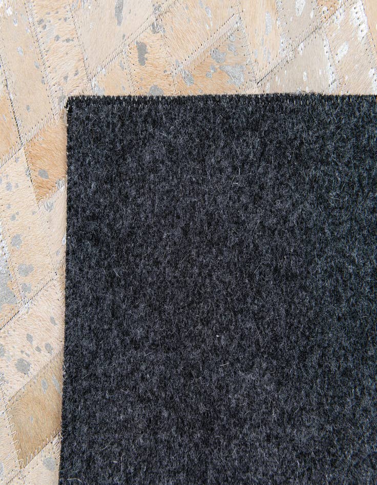 Detail image of  5' 3 x 7' 6 Cowhide Stocks Rug