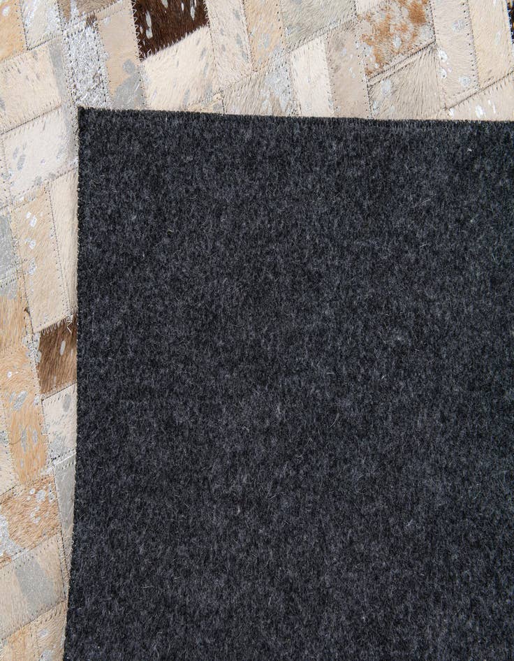 Detail image of  5' 3 x 7' 6 Cowhide Stocks Rug