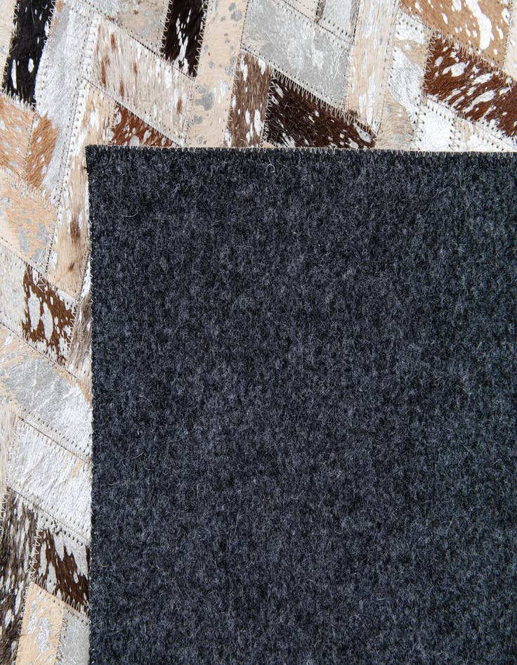 Detail image of  5' 3 x 7' 3 Cowhide Stocks Rug