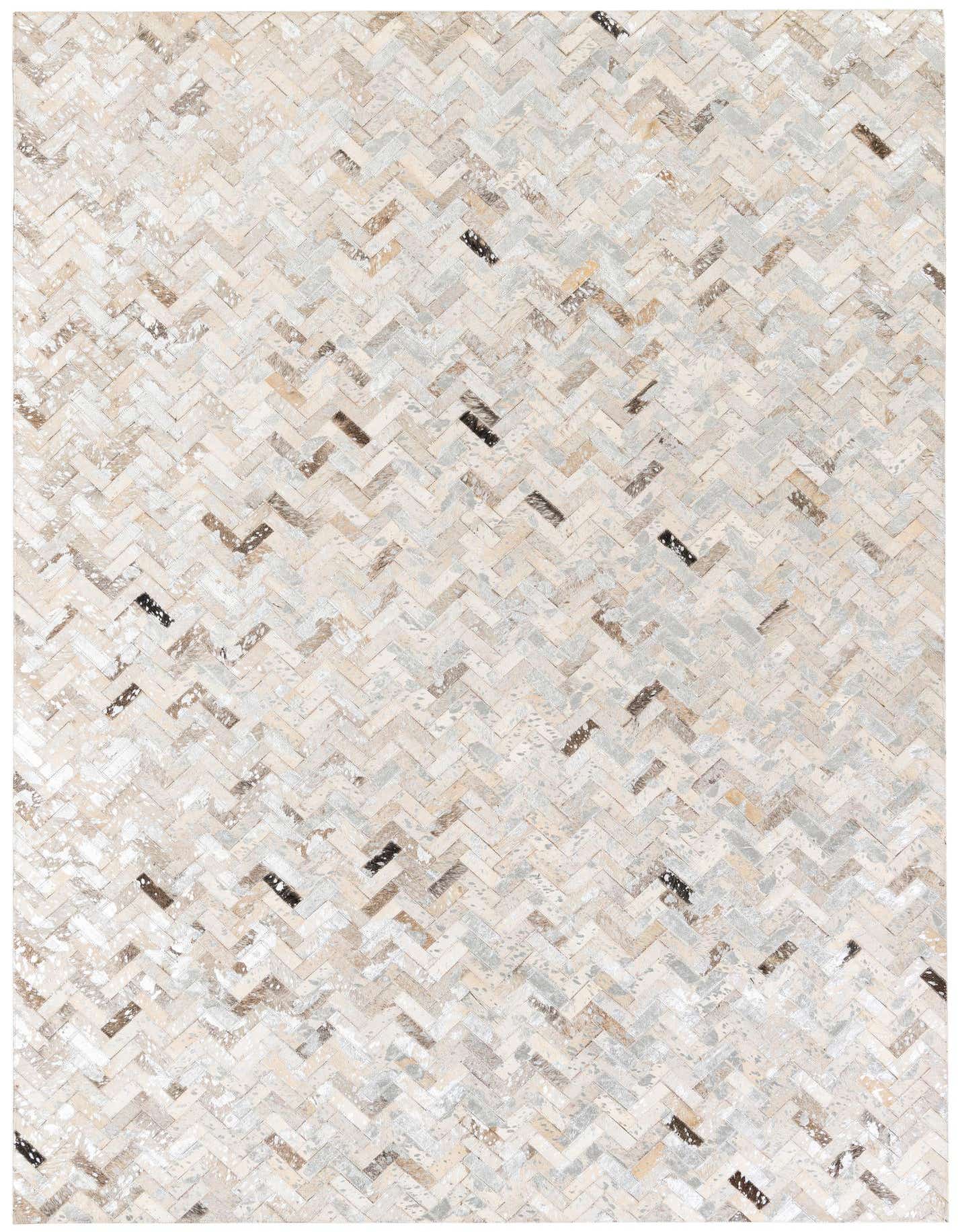 A rectangular 5x8 modern Cowhide Stocks rug from Rugs.com, featuring a multi-colored herringbone pattern in various natural cowhide tones, ideal for a living room.