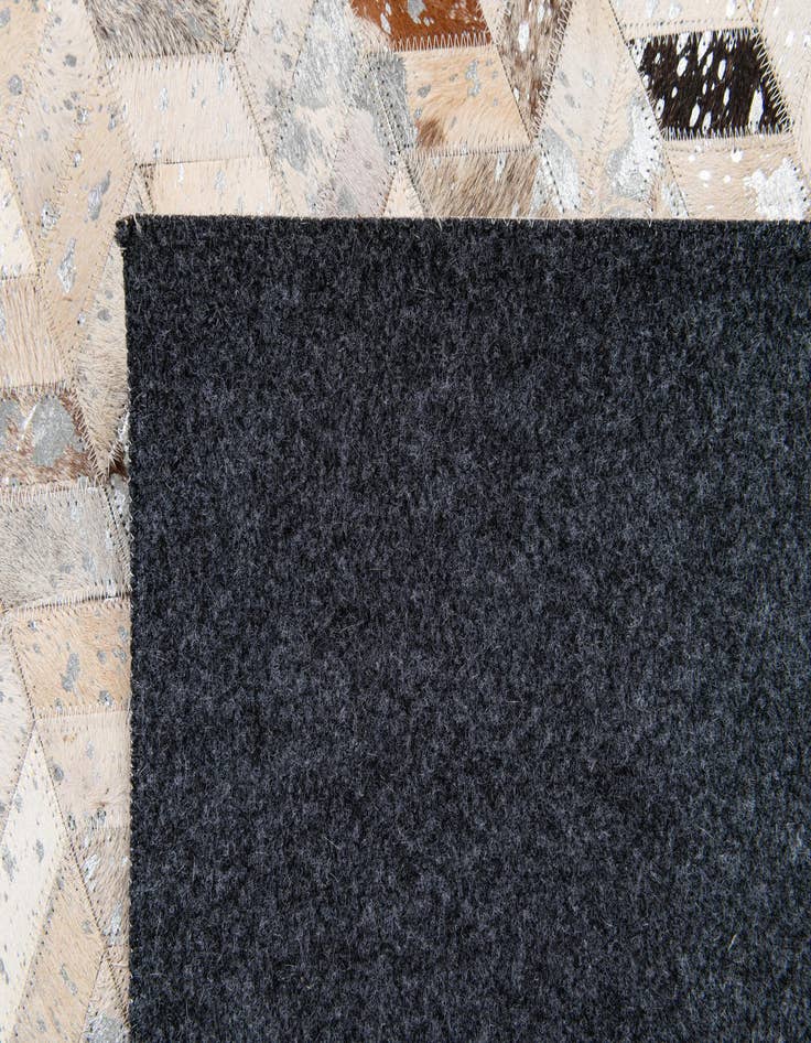 Detail image of  5' 4 x 7' 7 Cowhide Stocks Rug