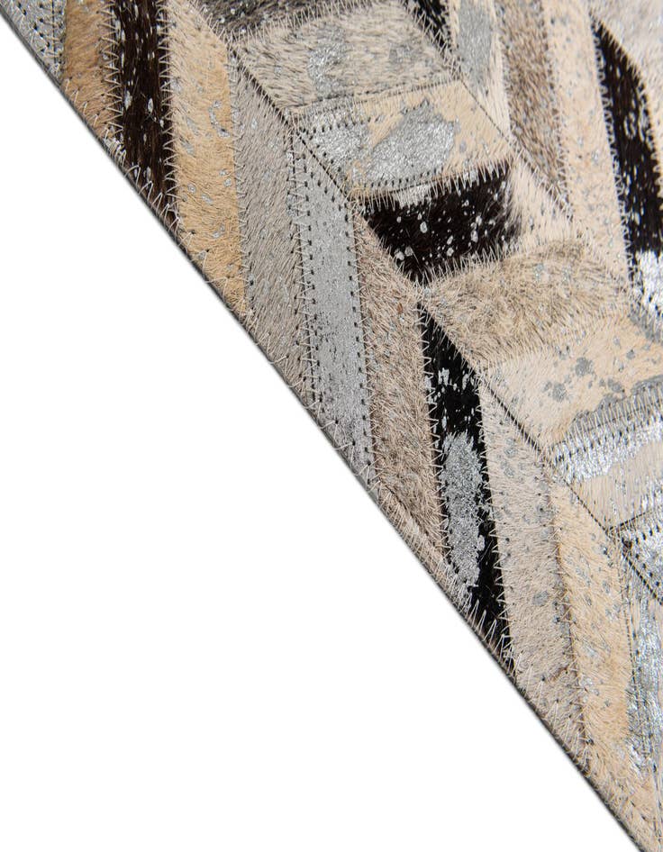 Detail image of  5' 3 x 7' 6 Cowhide Stocks Rug