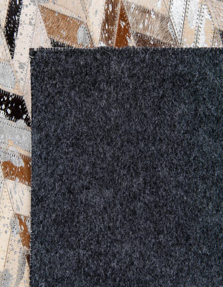 Detail image of  5' 3 x 7' 6 Cowhide Stocks Rug